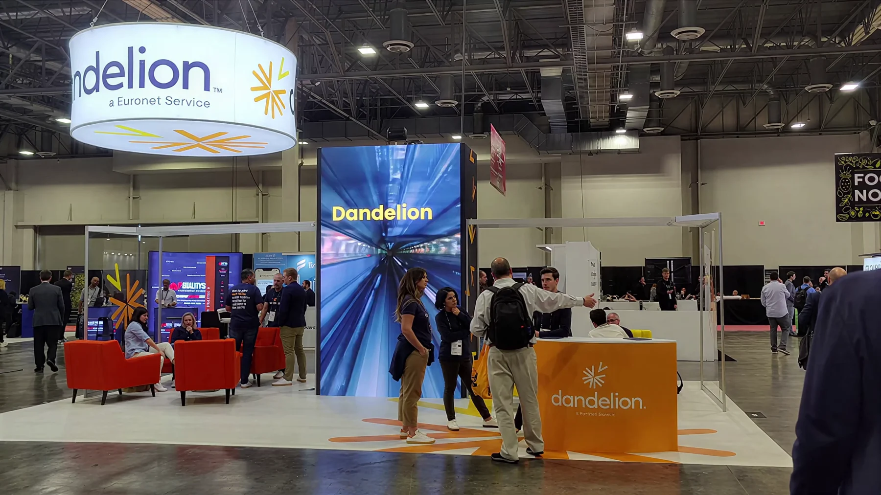 Dandelion by Euronet trade show booth with a vertical LED pillar in Las Vegas
